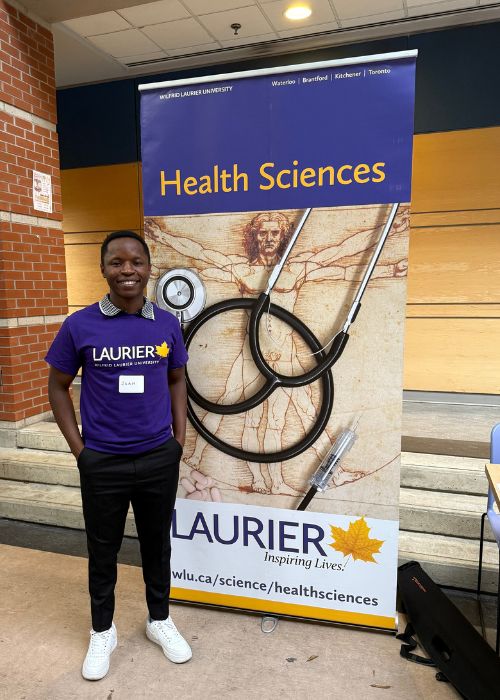 Ruvahafi, a Heatlh Sciences program ambassador, at fall 2025 Open House at Laurier's Waterloo campus.