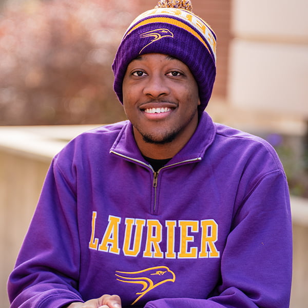 Smiling student wearing Laurier apparel